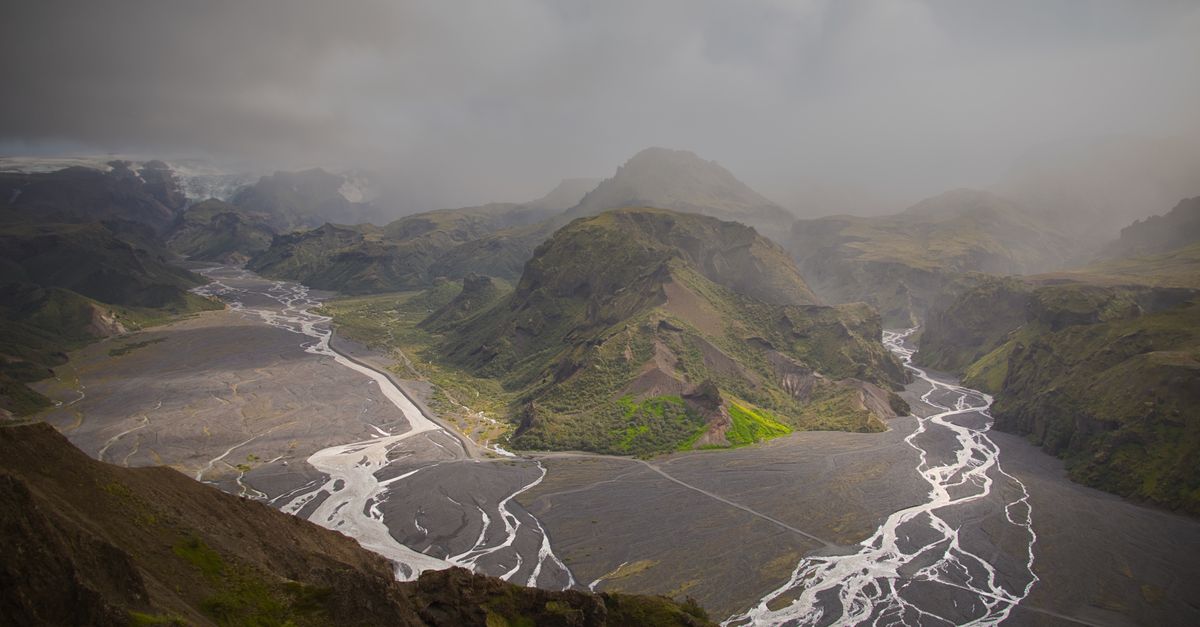 Explore the breathtaking aerial view of Iceland's dramatic valleys and vibrant landscapes.